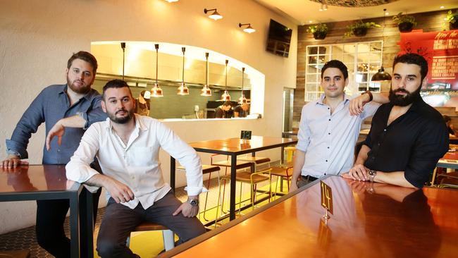 Ghanem brothers Wasim, Adonis, Nazar, and Nehme, at their Carindale Lord of the Wings store. Picture: Liam Kidston