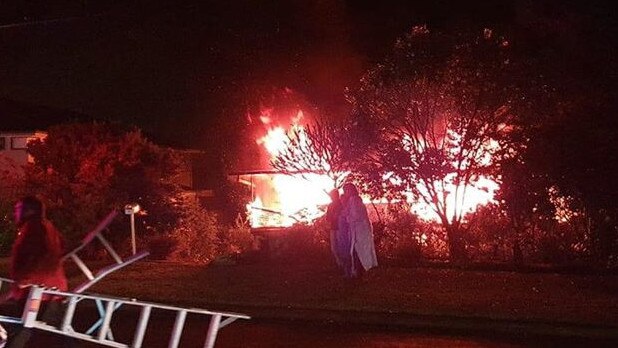 An elderly couple had to rescued from the first floor of their home in Dublin Ave, Killarney Heights, by a group of neighbours who used a ladder to help them away from the blaze before firefighters arrived. Picture: Facebook