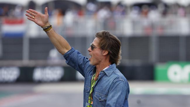 Brad Pitt waves to the crowd from the grid during the F1 Grand Prix of USA. Picture: Getty Images