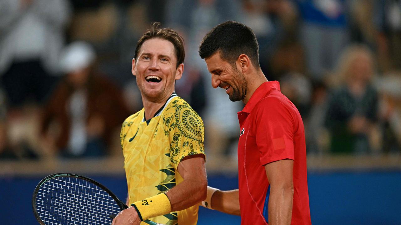 Serbia's Novak Djokovic shares a joke with Australia's Matthew Ebden. Picture: Patricia De Melo Moreira/AFP