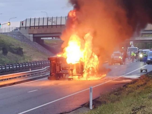 Two people in hospital after fiery rollover shuts highway