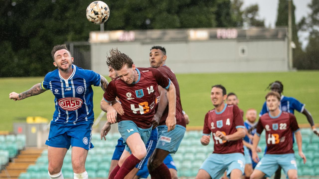 Jack Armson battling Olympic skipper Roy O Donovan for a header. Picture: Julian Andrews