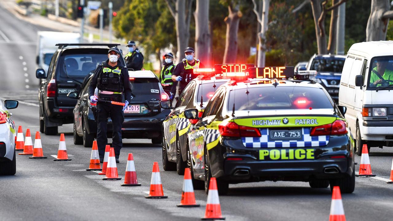 Police pull vehicles aside at a checkpoint in the locked-down suburb of Broadmeadows. Picture: William WEST/AFP