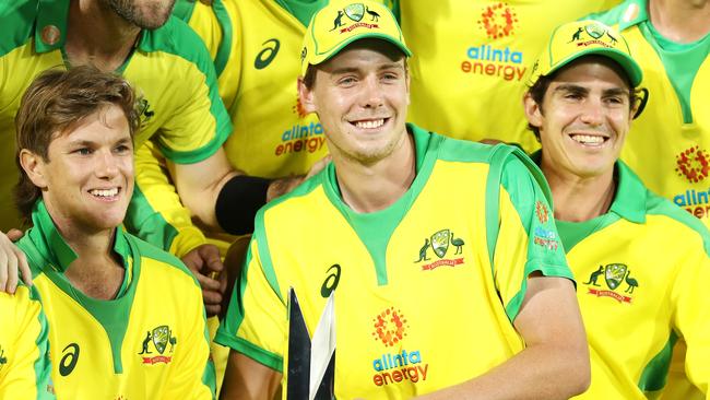 CANBERRA, AUSTRALIA - DECEMBER 02: Cameron Green holds the trophy as the Australian team pose after their series win 2-1 after game three of the One Day International series between Australia and India at Manuka Oval on December 02, 2020 in Canberra, Australia. (Photo by Mark Kolbe/Getty Images)