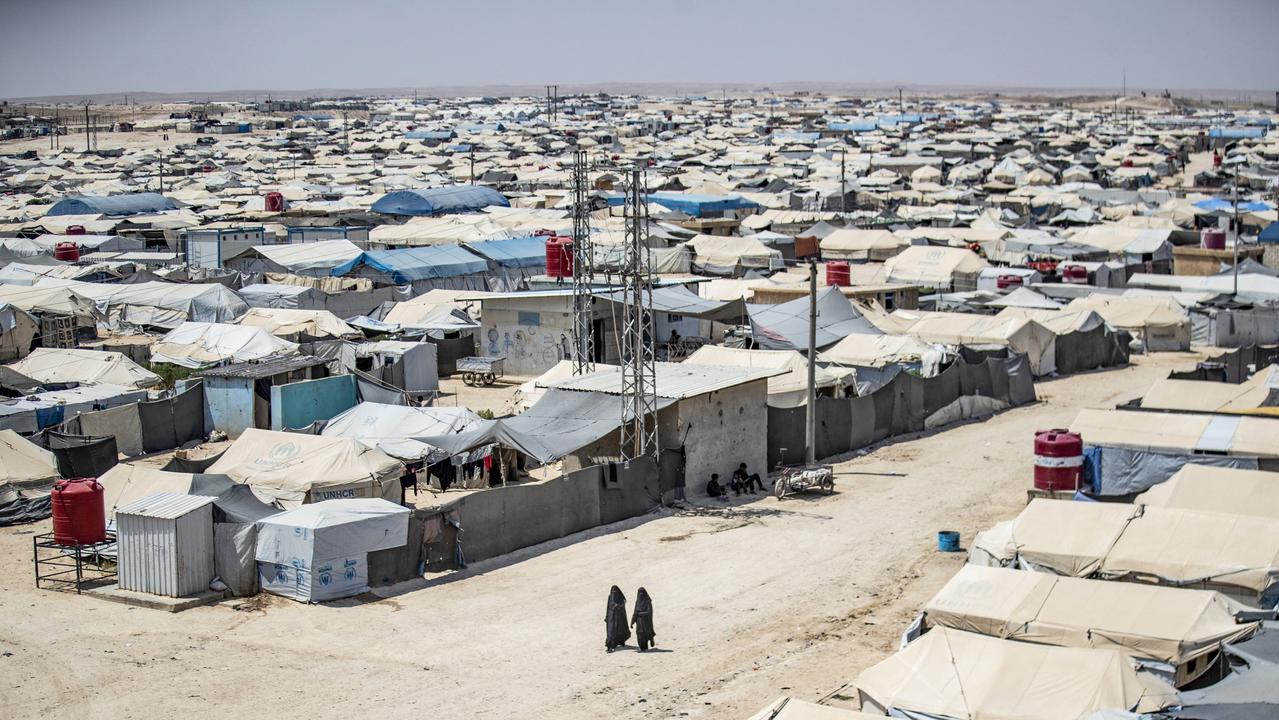 Women walk among shelters at the Kurdish-run al-Hol camp. Picture: Delil Souleiman/AFP