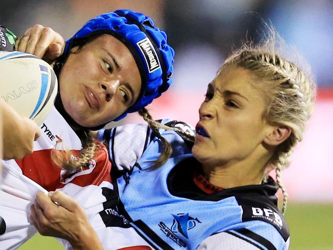 Erin Blackwell of the Dragons tackled by Allana Ferguson of the Sharks. pic Mark Evans