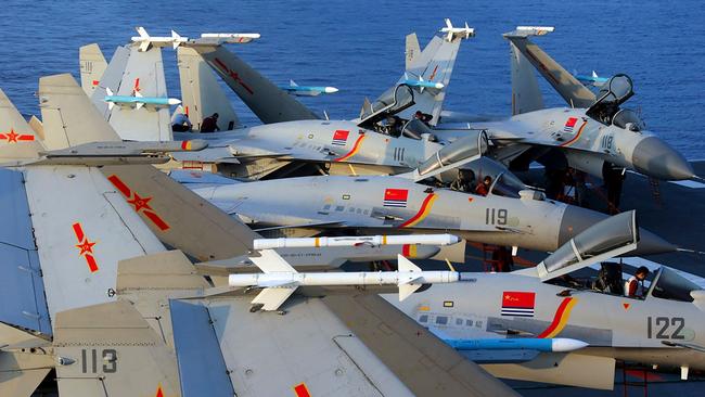 J-15 fighter jets on China's operational aircraft carrier, the Liaoning. China has built the world's largest navy, revamped the world's largest standing army and amassed a nuclear and ballistic arsenal. Picture: AFP.