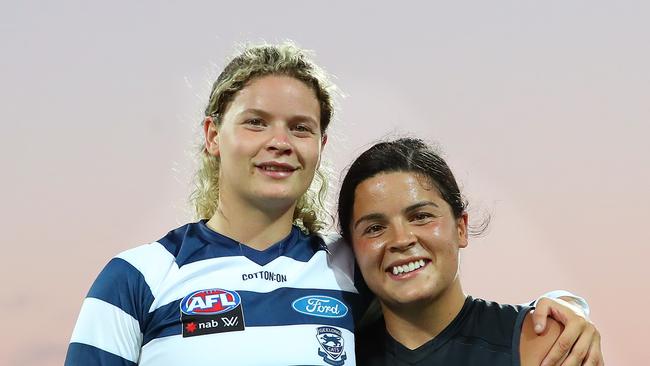 GEELONG, AUSTRALIA – JANUARY 15: Madison Prespakis of the Blues and Georgie Prespakis of the Cats pose for a portrait after the match during the round two AFLW match between the Geelong Cats and the Carlton Blues at GMHBA Stadium on January 15, 2022 in Geelong, Australia. (Photo by Kelly Defina/Getty Images)