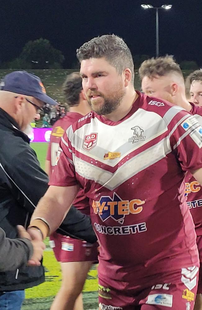 150-game Kawana Dolphin Joel Fitzgerald accepts his premiership medal. Picture: Matty Holdsworth