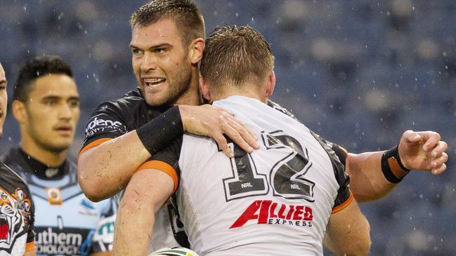 Tigers Tim Grant hugs Chris Lawrence after a try during the Wests Tigers v Cronulla Sharks pre season trial game at Campbelltown Stadium , Campbelltown. Pic Jenny Evans