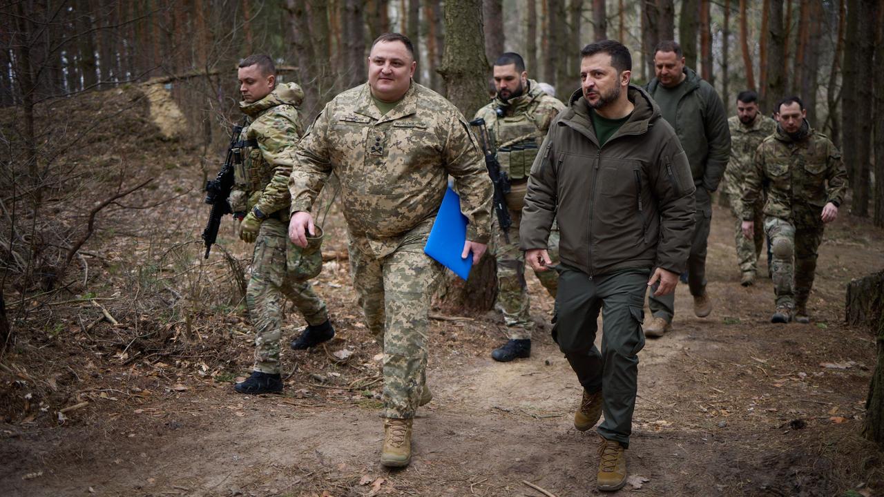 Zelensky with Ukrainian servicemen. Picture: AFP/Ukrainian Presidential press service