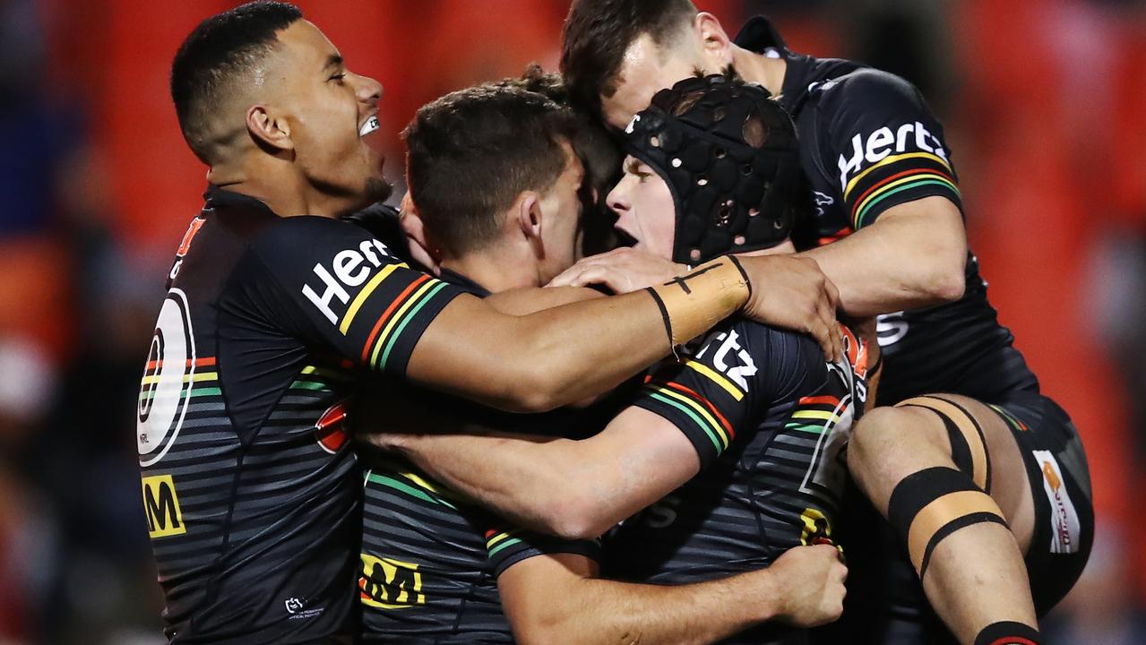 Nathan Cleary of the Panthers celebrates with teammates.