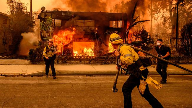 Efforts to fight the fires have been hampered with reports of fire hydrants running empty. Picture: JOSH EDELSON / AFP