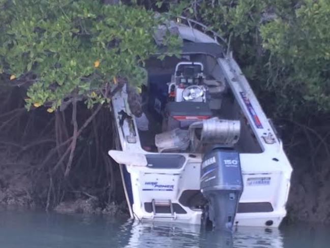 A boat that was abandoned after crashing into the bank at the Narrows, on the Adelaide River