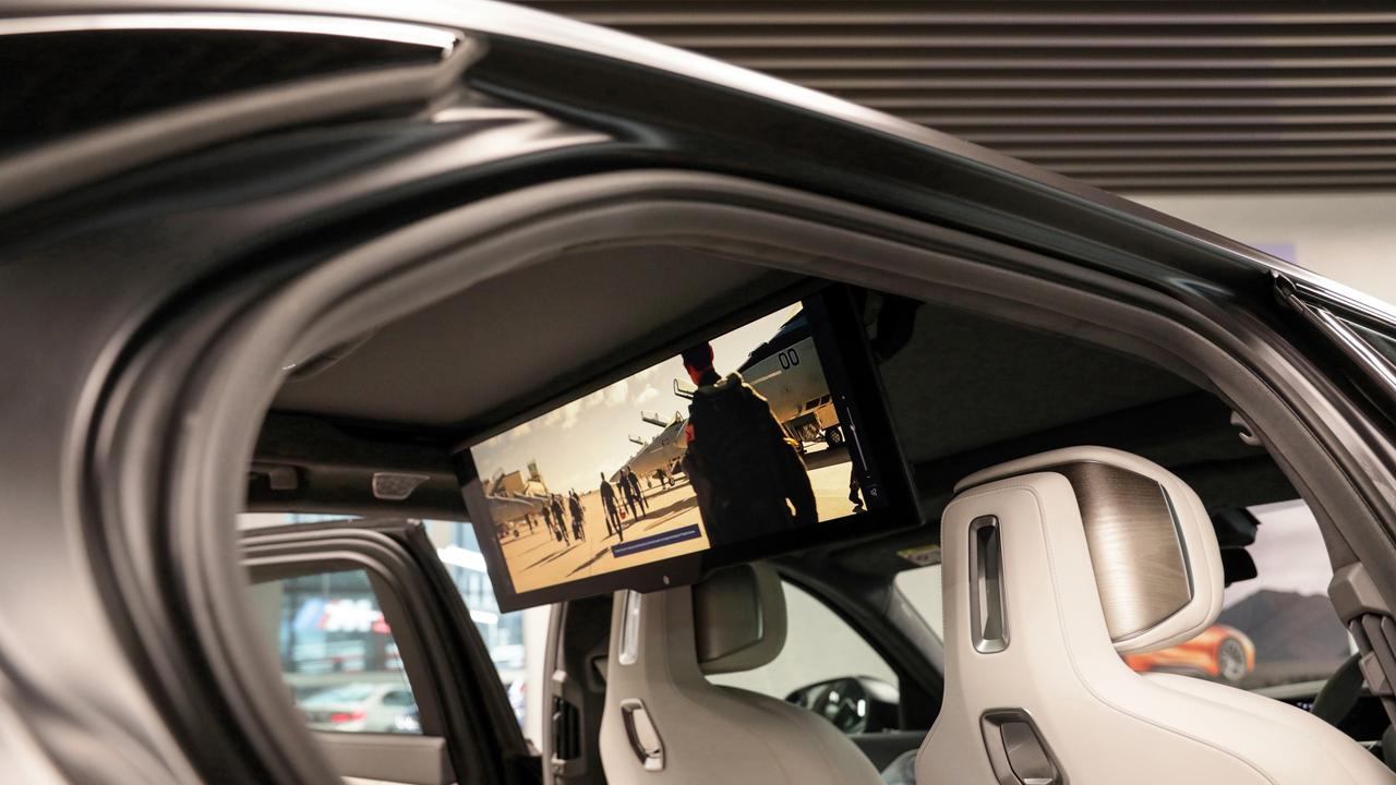 Sit back and relax with the rear entertainment screen in the BMW i7.