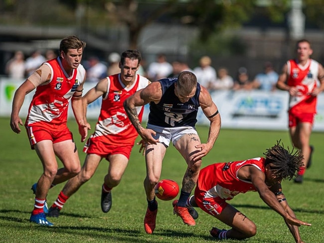 Rosebud's Jai Hardwick goes after the ball against Sorrento. Picture: David Caspar