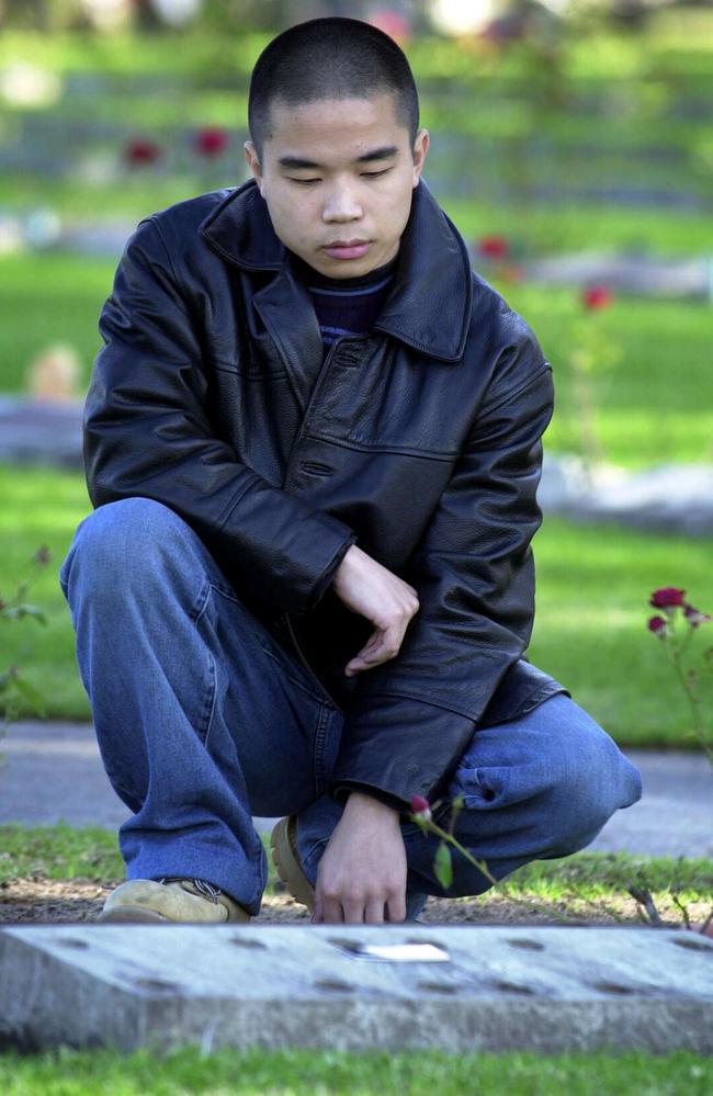 Gonzales visiting graves of his family before he was arrested for their murder.