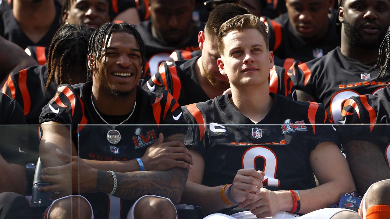 LOS ANGELES, CALIFORNIA - FEBRUARY 12: Ja'Marr Chase #1 and Joe Burrow #9 of the Cincinnati Bengals look on during the team photo session at SoFi Stadium on February 12, 2022 in Los Angeles, California. The Bengals will play against the Los Angeles Rams in Super Bowl LVI on February 13. Ronald Martinez/Getty Images/AFP == FOR NEWSPAPERS, INTERNET, TELCOS &amp; TELEVISION USE ONLY ==