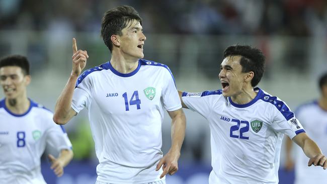 Uzbekistan's Eldor Shomurodov celebrates after scoring the opening goal against Japan at Khalifa bin Zayed Stadium in Al Ain. Picture: Kamran Jebreili