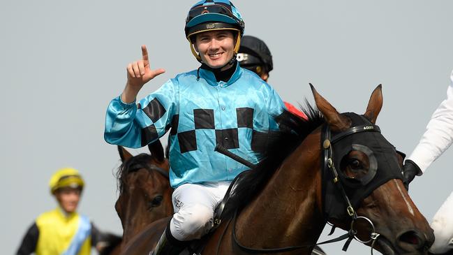 Jockey Michael Hellyer gestures after riding She’s Furline to victory in race 5, the Class 3 Handicap, during Metro Races at Doomben Racecourse in Brisbane, Saturday, December 7, 2019. Picture: AAP Image/Albert Perez