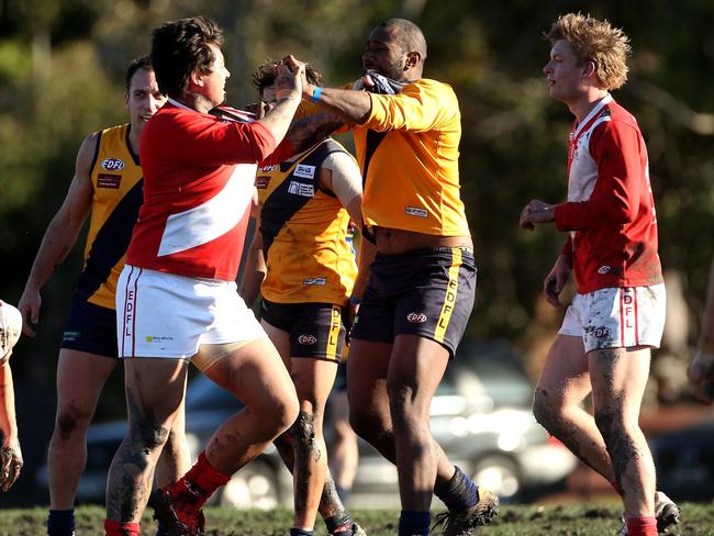 Glenroy’s Joshua Ksiazek and Strathmore’s Rusiate Komaitai lock horns. Picture: Hamish Blair