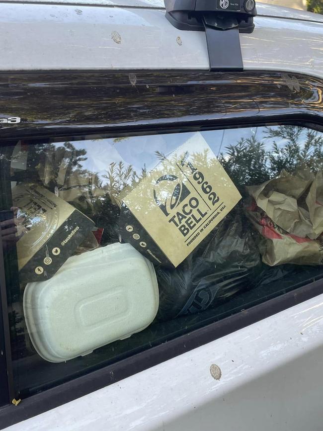 A man south of Brisbane said this car filled with fast food packaging 'suddenly appeared in our street in Mansfield' on Monday afternoon. Photo: Malcolm Cleary-Polzin/Facebook