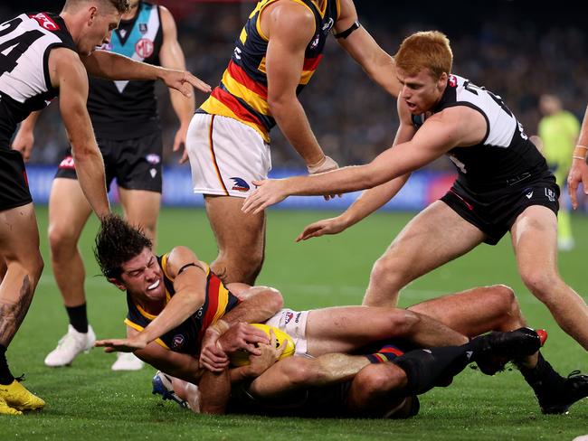 Scott Lycett slings Ned McHenry to the turf.