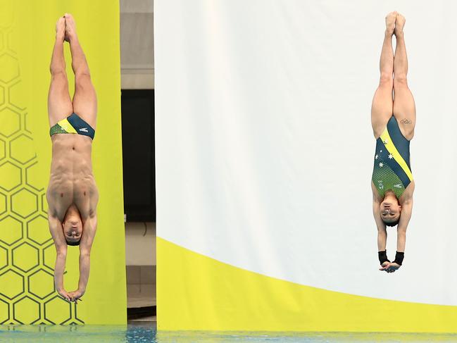 Divers Sam Fricker and Melissa Wu dive during the Australian 2020 Tokyo Olympic Games Swimming uniform launch. Picture: Cameron Spencer/Getty Images