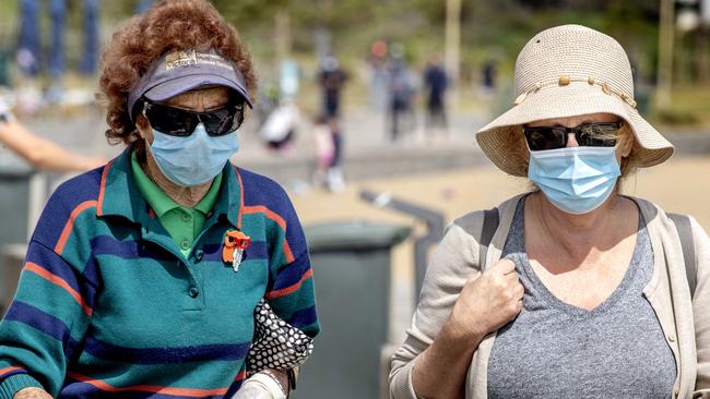 Victorians are still required to wear face masks while outside. Picture: NCA NewsWire / David Geraghty