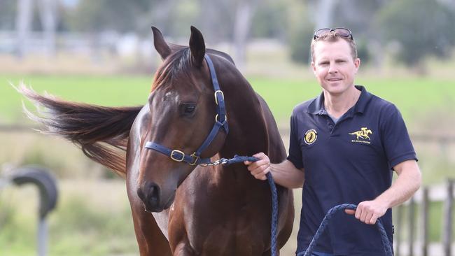 Ben Ahrens with Chillin with Dylan at his stables in Beaudesert. Pic Jono Searle.