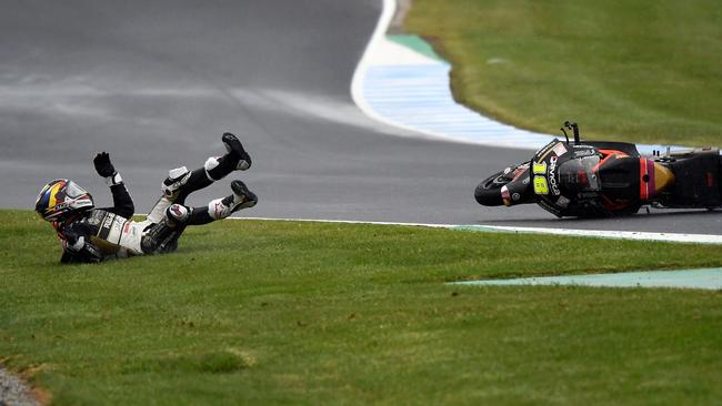 Moto2 rider Xavi Cardelus is separated from his bike.