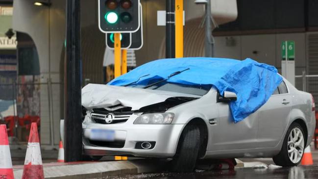 A man has died after being hit be a vehicle that was allegedly seen driving erratically moments before the incident.A blue tarpaulin covers the car involved in the incident in Bayswater. Picture: ABC