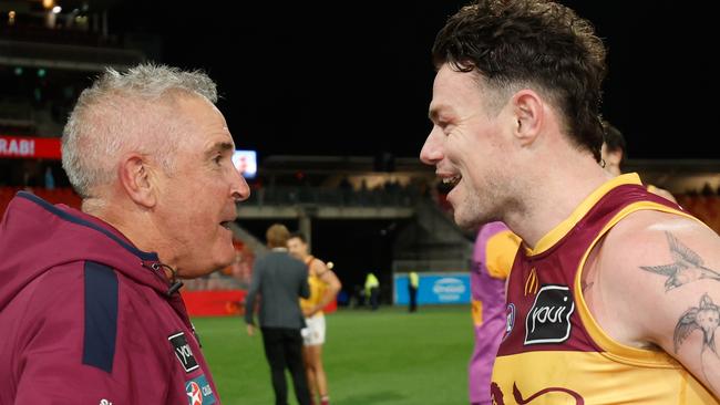 SYDNEY, AUSTRALIA - SEPTEMBER 14: Lachie Neale of the Lions celebrates with Chris Fagan, Senior Coach of the Lions during the 2024 AFL First Semi Final match between the GWS GIANTS and the Brisbane Lions at ENGIE Stadium on September 14, 2024 in Sydney, Australia. (Photo by Dylan Burns/AFL Photos via Getty Images)