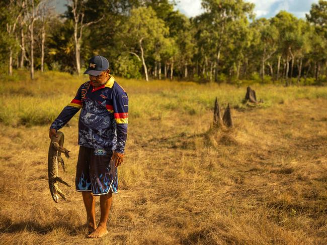 Garth Doolan with a goanna caught at Arrnyraybaykda, central Arnhem Land. Picture: Rebecca Parker