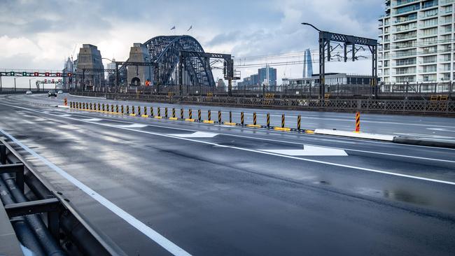 The normally busy roads on the northern side of the Sydney Harbour Bridge remain deserted during the lockdown on Sunday. Picture: Julian Andrews).