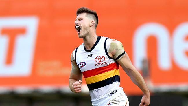 Bryce Gibbs celebrate a goal against Brisbane this year. Picture: Bradley Kanaris/Getty Images