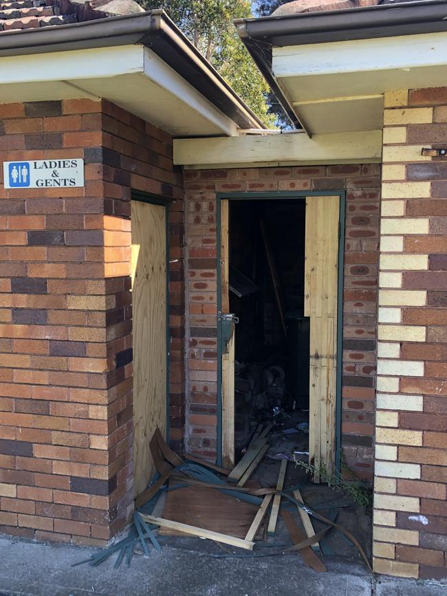 A kicked in door at the abandoned former North Manly Bowling Club. Picture: Jim O'Rourke