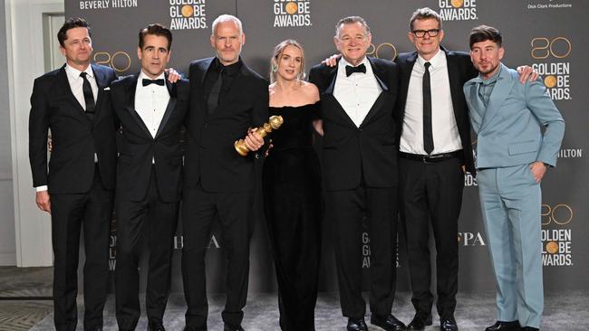 Peter Czernin, Irish actor Colin Farrell, British-Irish director Martin McDonagh, Irish actress Kerry Condon, Irish actor Brendan Gleeson, Graham Broadbent, and Irish actor Barry Keoghan poses with the award for Best Musical/Comedy Series for "The Banshees of Inisherin". Picture: AFP