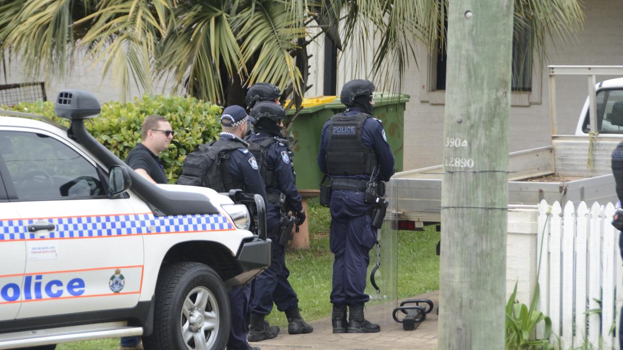 Tactical officers from the Queensland Police Special Emergency Response Team at the scene of a South Toowoomba home during a five-hour stand-off. Photo: Jarrard Potter.