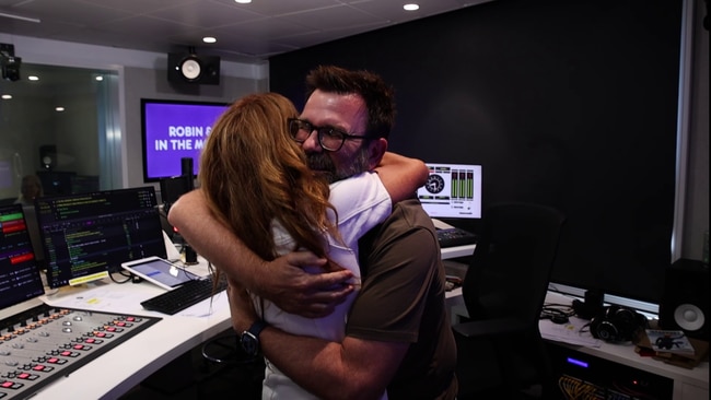 A touching moment between the radio hosts. Photo: KIIS97.3