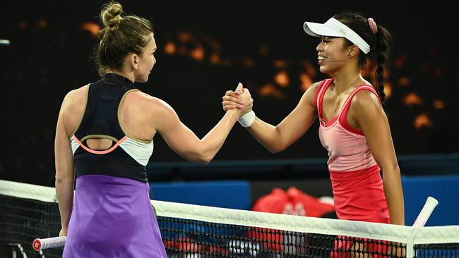 Simona Halep, left, and Lizette Cabrera of Australia after their match in Melbourne on Monday night. Picture: Getty Images