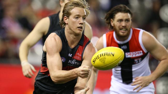 Essendon's Darcy Parish clears by hand. Pic: Michael Klein