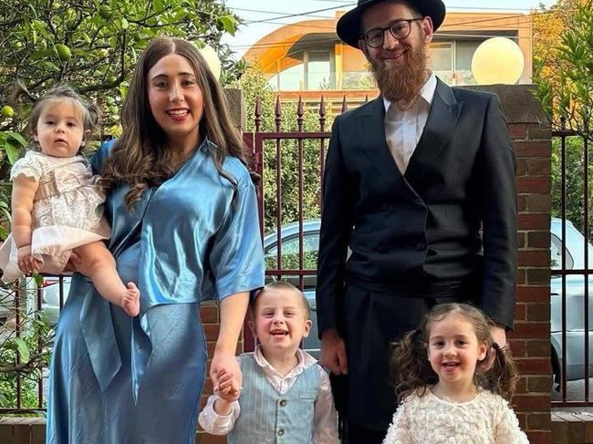 St Kilda religious leader Rabbi Effy Block and his family outside their home which was vandalised on Tuesday November 26, 2024. “Jews kill babies” and “free Palestine” was graffiti’d on their fence and car. Picture: Supplied