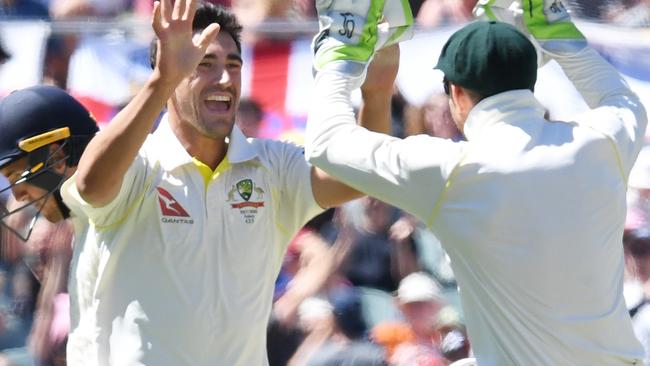 Mitchell Starc celebrates taking the wicket of Craig Overton. Picture: AAP.