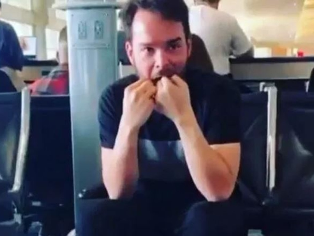 A man was caught flossing his teeth while waiting for his flight.
