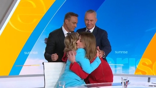 The Sunrise team hug it out.