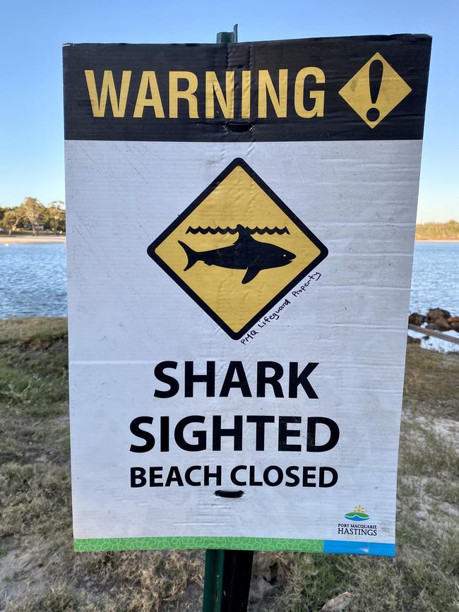 Warning signs posted after a shark sighting in Lake Cathie south of Port Macquarie. Picture: Nathan Edwards