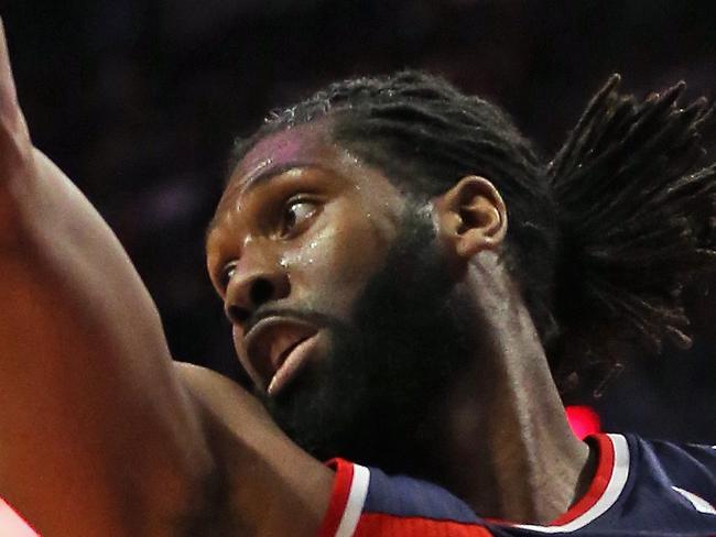 CHICAGO, IL - APRIL 22: Nene #42 of the Washington Wizards rebounds against the Chicago Bulls in Game Two of the Eastern Conference Quarterfinals during the 2014 NBA Playoffs at the United Center on April 22, 2014 in Chicago, Illinois. The Wizards defeated the Bulls 101-99. NOTE TO USER: User expressly acknowledges and agrees that, by downloading and or using this photograph, User is consenting to the terms and conditions of the Getty Images License Agreement. (Photo by Jonathan Daniel/Getty Images)