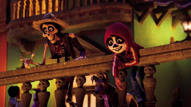 In a scene from Disney Pixar's animated film Coco, Miguel (voiced by Anthony Gonzalez) ends up in the Land of the Dead, where he teams up with a streetwise skeleton named Hector (Gael Garci­a Bernal) who helps Miguel blend into the crowd by giving him a little face paint. ©2017 Disney Pixar. All Rights Reserved.