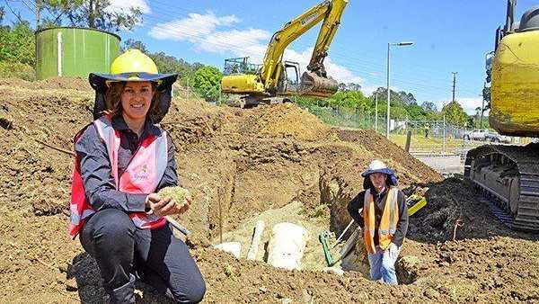 RECYCLED GLASS: Lismore City Council's Business Development Coordinator Danielle Hanigan and Stirloch Constructions Project Engineer Shane Mangan with the recycled glass being used as pipe bedding at the South Lismore Sewage Treatment Plant. Picture: Contributed